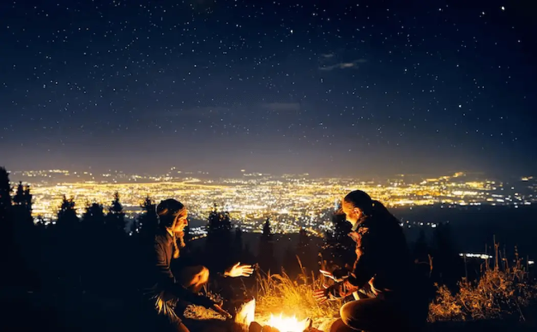 romantic-couple-near-campfire-starry-night_672794-2944 1